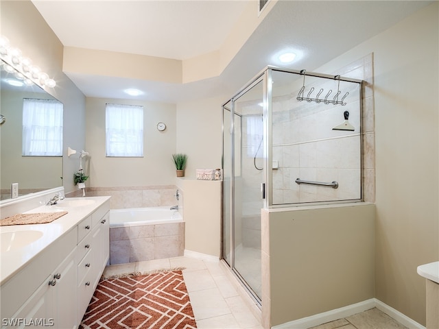 bathroom featuring independent shower and bath, dual bowl vanity, and tile floors