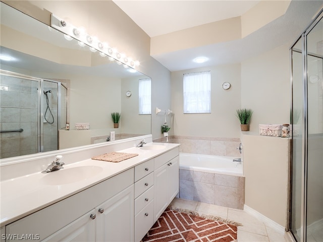 bathroom with independent shower and bath, double sink vanity, and tile flooring