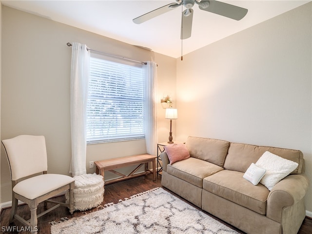 living room with ceiling fan and dark hardwood / wood-style floors