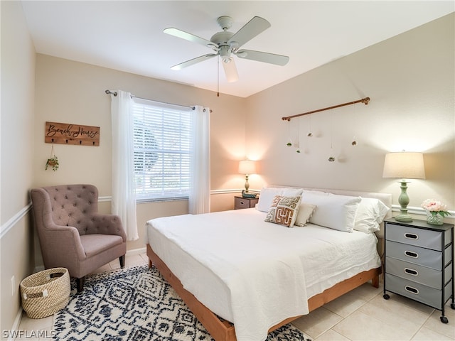 bedroom with light tile floors and ceiling fan