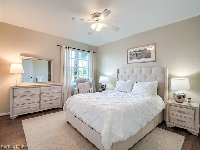 bedroom featuring ceiling fan and dark hardwood / wood-style floors