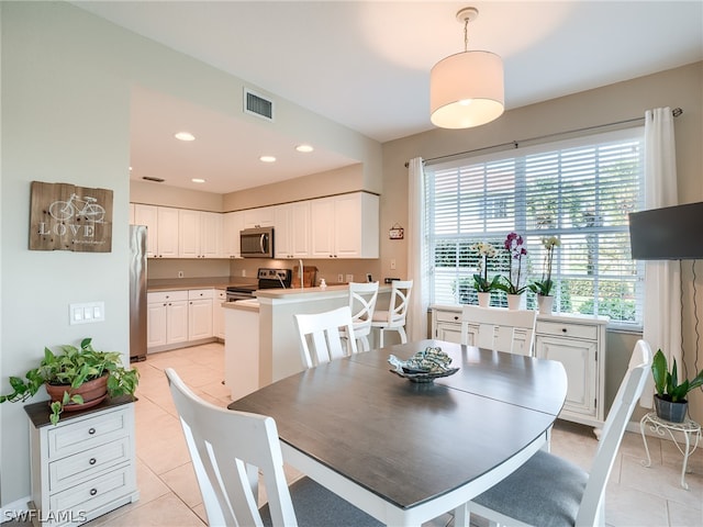 dining area with light tile floors