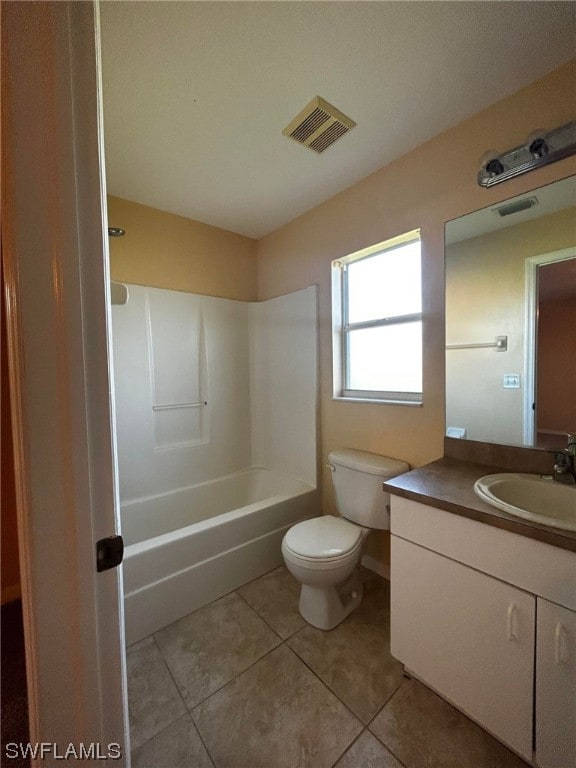 full bathroom featuring vanity, tile flooring, toilet, and washtub / shower combination