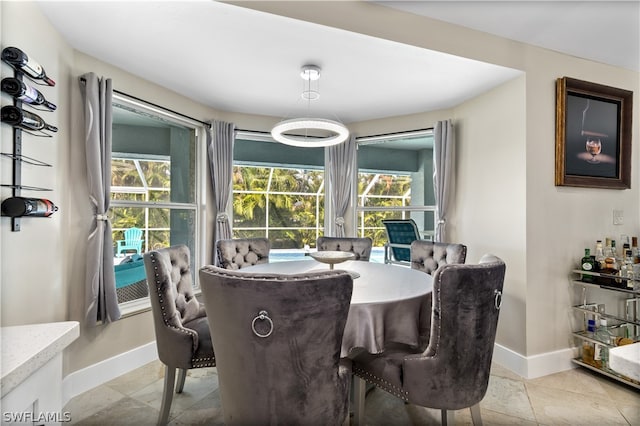 dining area with light tile patterned flooring