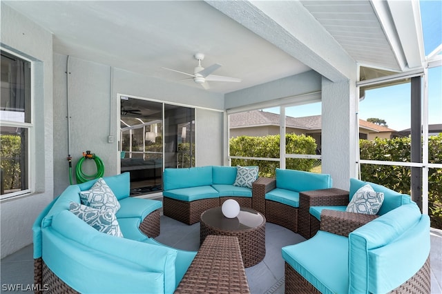 sunroom / solarium with a wealth of natural light and ceiling fan