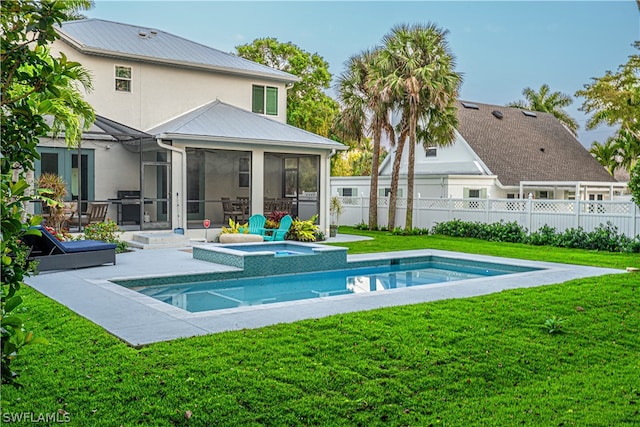 exterior space featuring a sunroom, a fenced in pool, a lawn, and a patio area