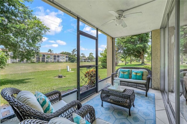 sunroom featuring ceiling fan