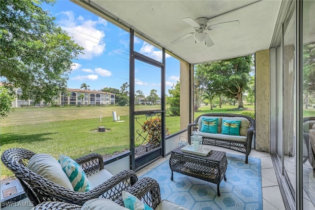 sunroom with a healthy amount of sunlight and a ceiling fan