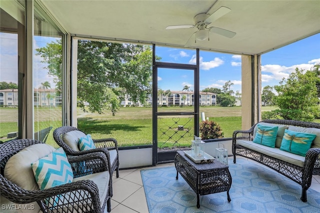 sunroom featuring a ceiling fan