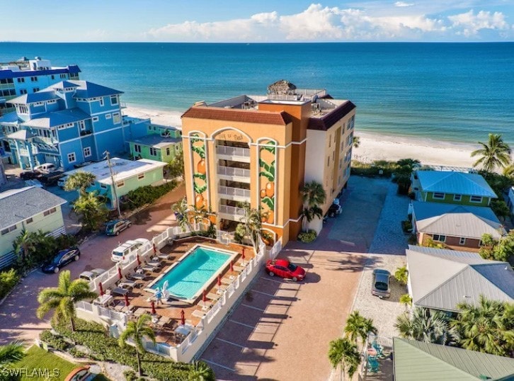 drone / aerial view featuring a view of the beach and a water view