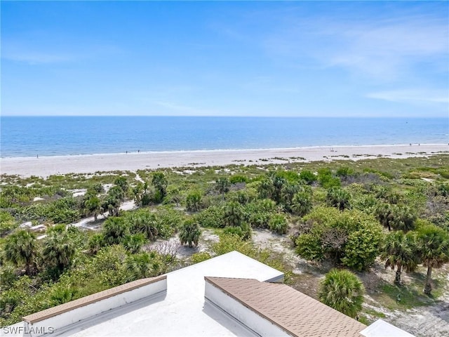 bird's eye view featuring a beach view and a water view