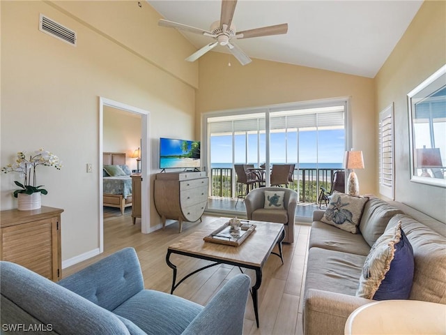 living room with high vaulted ceiling, ceiling fan, visible vents, and wood finished floors