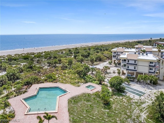 aerial view with a water view and a view of the beach