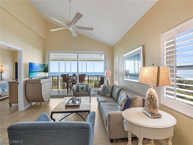 living room with ceiling fan, high vaulted ceiling, and wood finished floors