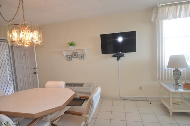 dining area featuring light tile floors and an inviting chandelier