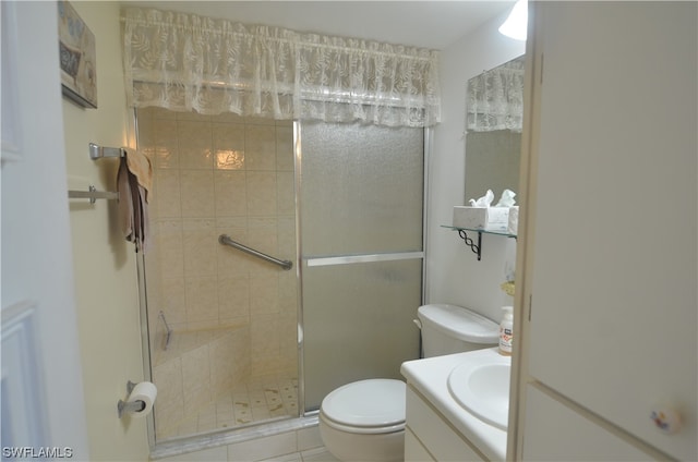 bathroom featuring walk in shower, tile floors, toilet, and oversized vanity