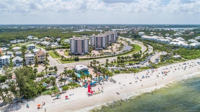 aerial view featuring a water view and a beach view