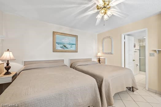 tiled bedroom with ceiling fan