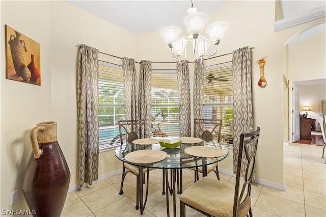 dining area featuring a chandelier and light tile flooring