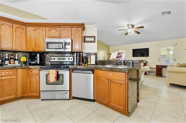 kitchen with backsplash, ceiling fan, sink, stainless steel appliances, and light tile floors