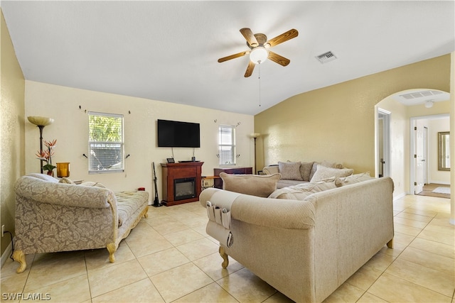 living room with light tile floors, vaulted ceiling, and ceiling fan