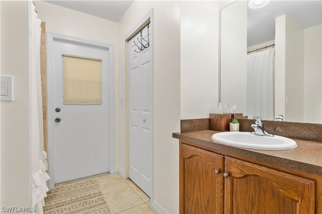 bathroom featuring vanity and tile flooring