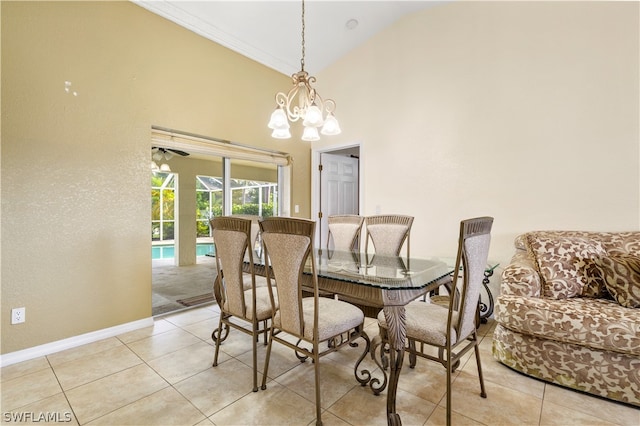 tiled dining area with high vaulted ceiling and an inviting chandelier