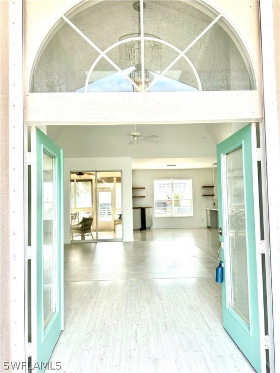 interior space featuring high vaulted ceiling and wood finished floors