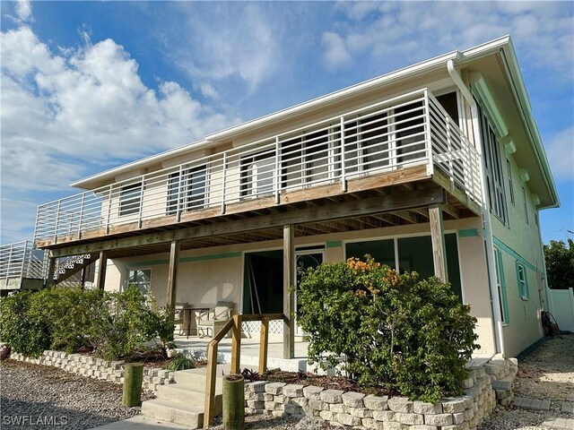 view of front of home with a wooden deck