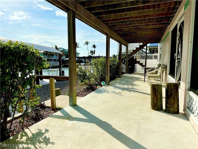 view of patio with a water view