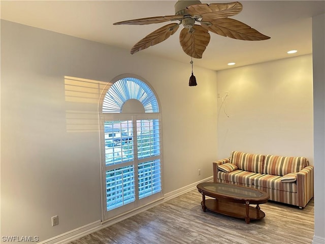 sitting room featuring a ceiling fan, recessed lighting, baseboards, and wood finished floors