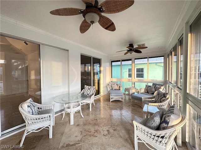 sunroom featuring visible vents and a ceiling fan