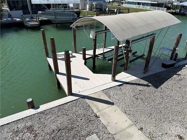 view of dock featuring a water view and boat lift