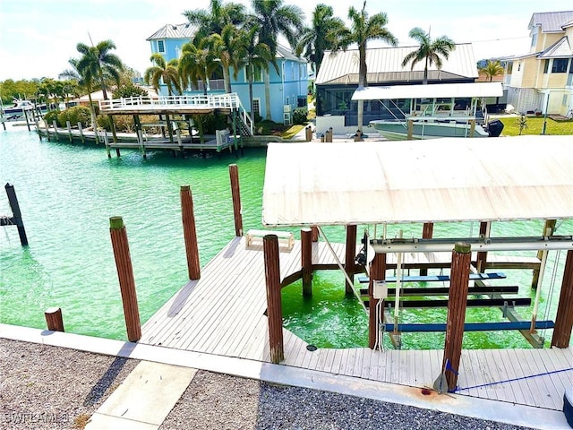 dock area featuring a water view and boat lift