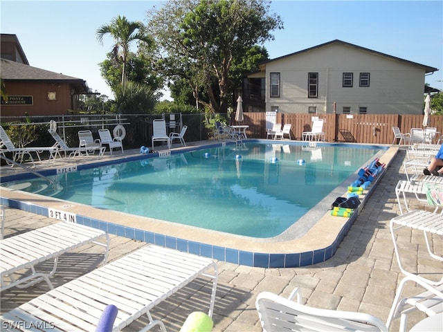 view of swimming pool with a patio area