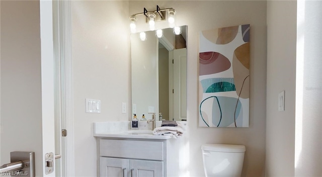 bathroom with oversized vanity and toilet