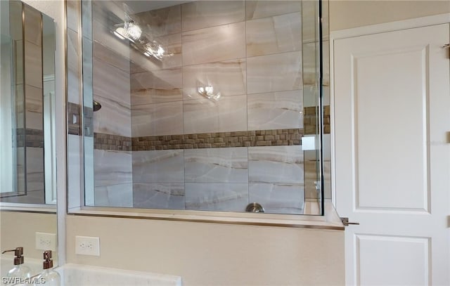 bathroom with a tile shower