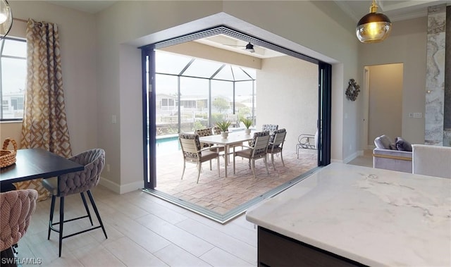 dining space featuring ceiling fan and light wood-type flooring