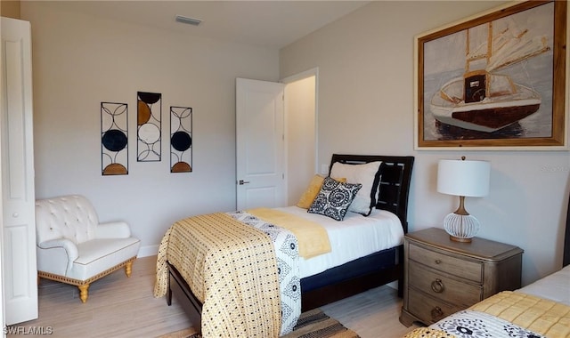 bedroom with light wood-type flooring