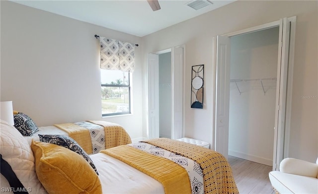 bedroom featuring a closet, ceiling fan, and light hardwood / wood-style flooring