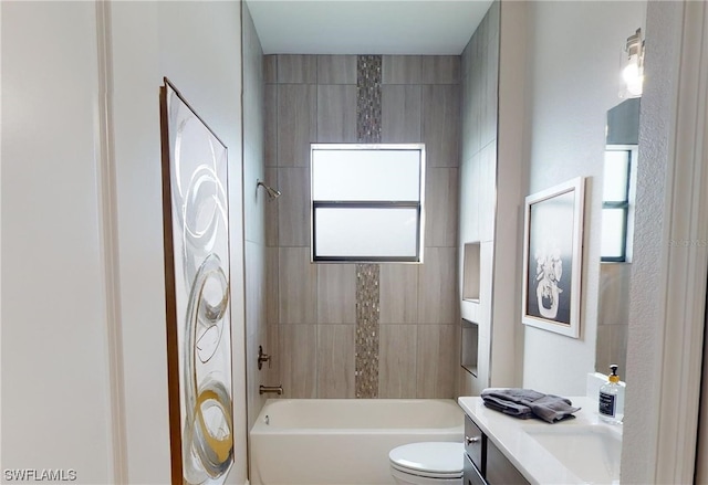 full bathroom featuring vanity, toilet, and tiled shower / bath