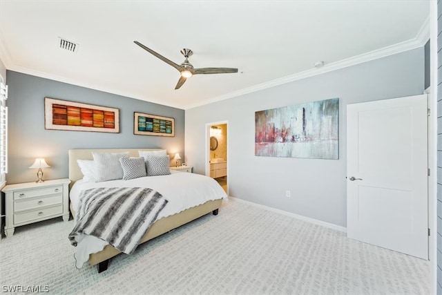 carpeted bedroom with ensuite bath, ceiling fan, and ornamental molding