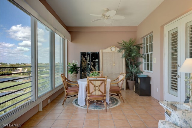 sunroom featuring ceiling fan