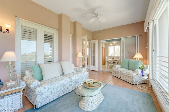 living room with light tile patterned floors, french doors, and ceiling fan