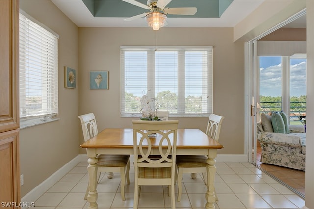 dining area featuring ceiling fan and light tile patterned flooring