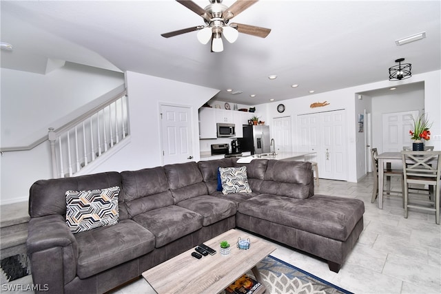 living room with ceiling fan and light tile floors