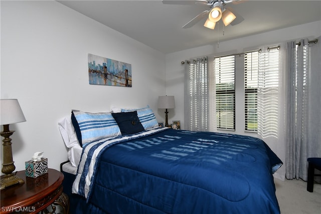 bedroom with ceiling fan and carpet flooring