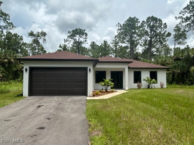 view of front facade with a front lawn and a garage