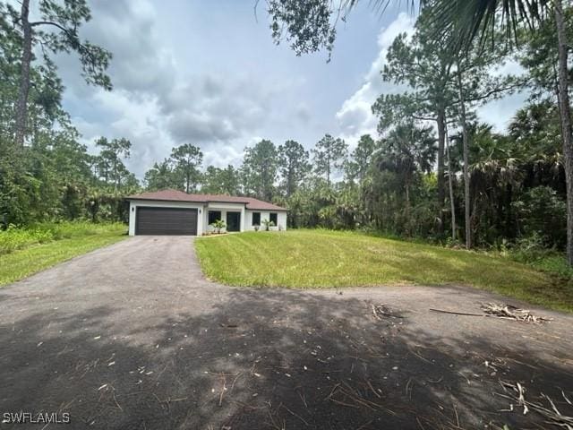 single story home featuring a garage