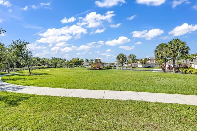 view of property's community with a lawn